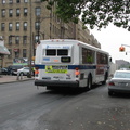 NYCT Orion V 6033 II @ Kingsbridge Ave and 231 St (Bx7). Note that the rear of the bus is painted white instead of black. Photo