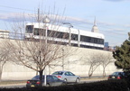 The HBLR LRV is going down the ramp to ground level in order to head in to Hoboken. Photo by Brian Weinberg, 01/23/2003.