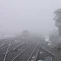 An M-1 trainset fades into the fog @ Jamaica. Photo taken by Brian Weinberg, 02/23/2003. (81kb)