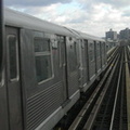R-42 4618 @ Williamsburg Bridge (M). Photo by Brian Weinberg, 11/27/2002. (90k)