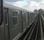 R-42 4618 @ Williamsburg Bridge (M). Photo by Brian Weinberg, 11/27/2002. (90k)