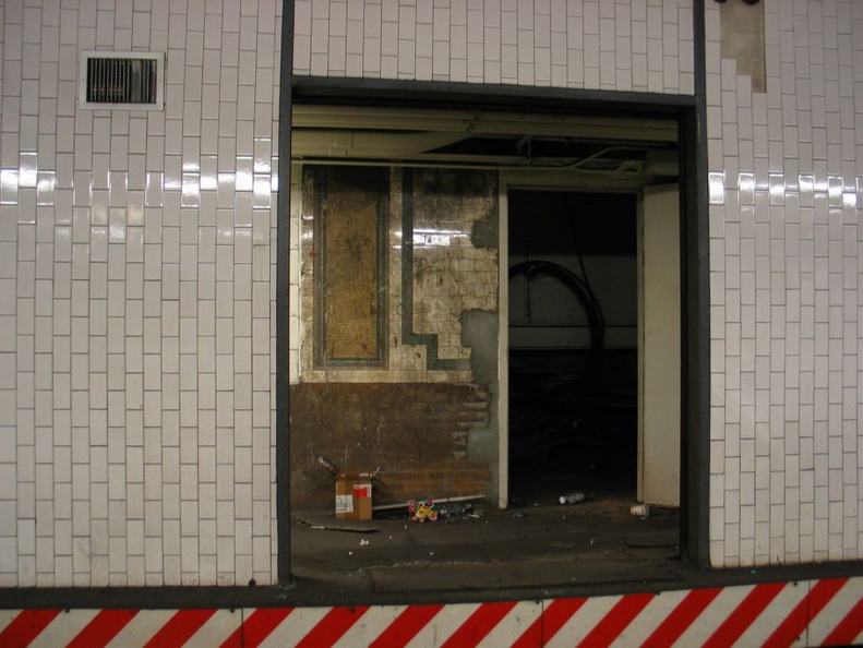 Open door to the sealed up northbound side platform @ 14 St-Union Square (4/5/6). Note the original tile seen on the inside wall. Photo taken by Brian Weinberg, 1/4/2004. IMG_8094.jpg