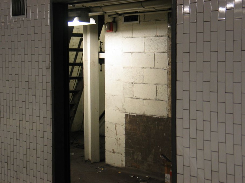 Open door to the sealed up northbound side platform @ 14 St-Union Square (4/5/6). Note the original tile seen on the inside wall. Photo taken by Brian Weinberg, 1/4/2004. IMG_8100.jpg