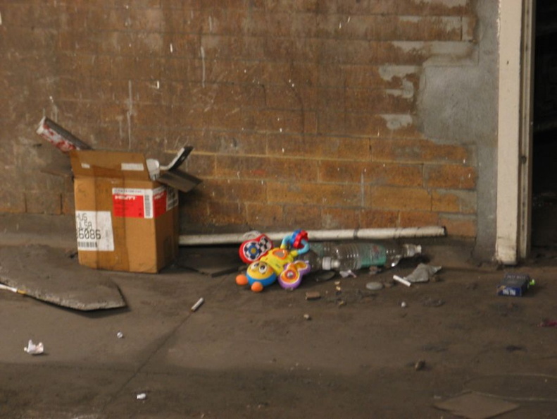 Open door to the sealed up northbound side platform @ 14 St-Union Square (4/5/6). Note the rubbish seen on the floor. Photo taken by Brian Weinberg, 1/4/2004. IMG_8102.jpg