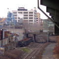 Bombed out caboose and some gondola cars below Sutter Av (L). Photo by Brian Weinberg, 11/27/2002. (172k)