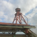 Air raid siren on the roof of the nb platform @ Sutter Av (L). Photo taken by Brian Weinberg, 12/29/2002. (60k)