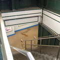 Looking down the stairs in a PATH kiosk @ Hoboken Terminal. Photo by Brian Weinberg, 01/26/2003.