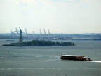 barge passing the Statue of Liberty