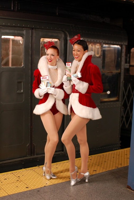 Rockettes Lauren Gaul, left, and Naomi Hubert ride the Arnines in service (incl. R-6 1300).