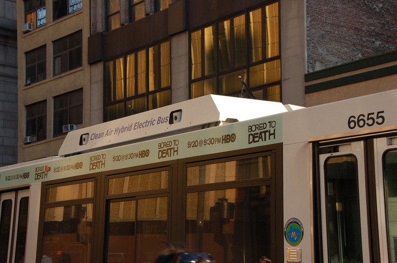 MTA NYCT Bus Orion VII Hybrid Electric 6655 @ 31 St and 8 Ave. Note the ads above the windows, near the roof. - MTA NYCT Bus Orion VII Hybrid Electric 6655 @ 31 St and 8 Ave. Note the ads above the windows, near the roof. DSC_2021.jpg
