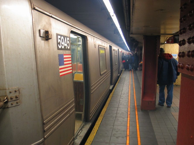 R-46 5945 @ 34 St-Herald Square (F). Train was taken out of service due to a smoke condition. Photo taken by Brian Weinberg, 3/9/2004. IMG_9341.jpg