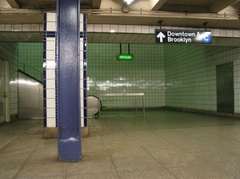 Escalator and stairs at the downtown lower level platform @ 50 St (E). Photo taken by Brian Weinberg, 5/30/2004.