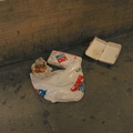 Domino's Pizza bag several hours later, after the large rat had finished with it. Photo taken by Brian Weinberg, 5/30/2004.