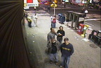 Still image from one of the Times Square WebCams. Brian Weinberg is in the foreground on the left with the hat and cellphone to