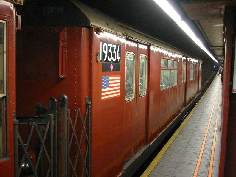 R-33WF 9334 @ 34 St - Herald Square (SB exp track). Part of a work train. Photo taken by Brian Weinberg, 10/22/2004.