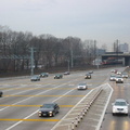 Northbound lanes @ New York State Thruway's New Rochelle Toll Barrier. The Northeast Corridor rail line is in the background, wi