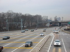 Northbound lanes @ New York State Thruway's New Rochelle Toll Barrier. The Northeast Corridor rail line is in the background, wi
