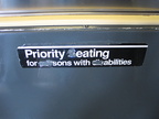 Sign reads: Priority eating for sons with abilities. On an R-42.