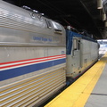 Amtrak AEM7 926 and baggage car 1711 @ Newark Penn Station. Photo taken by Brian Weinberg, 7/17/2005.