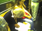 This guy that does pencil drawings of people on the subway (on a 3 train). Photo taken by Brian Weinberg, 9/14/2005.