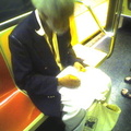 This guy that does pencil drawings of people on the subway (on a 1 train). Photo taken by Brian Weinberg, 9/14/2005.