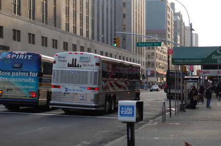 NYCT MCI Cruiser 2185 @ 23 St (X28). This is the 9-11-01 bus. Photo taken by Brian Weinberg, 1/25/2006.