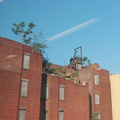 Run-down building near the Harlem-125th Street MNCR station. Is that an old elevator on top? Photo taken by Brian Weinberg, 6/30