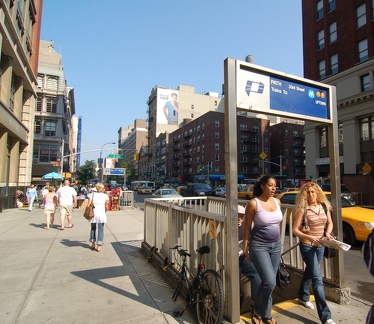 SE entrance to 23 St &amp; 6 Av (F/V/PATH). This entrance is maintained by PATH. Note the yellow sign depicting stairs going UP