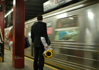 Sunflower man and R-68 2897 @ 47-50 Sts - Rockefeller Center (D). Photo taken by Brian Weinberg, 8/4/2006.