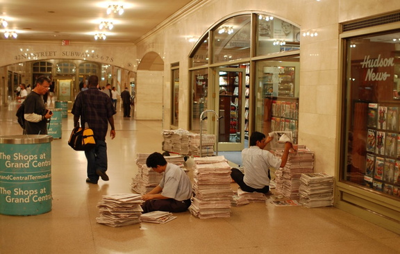 Newspapers being prepared for sale at Hudson News @ Grand Central Terminal. Photo taken by Brian Weinberg, 8/30/2006.