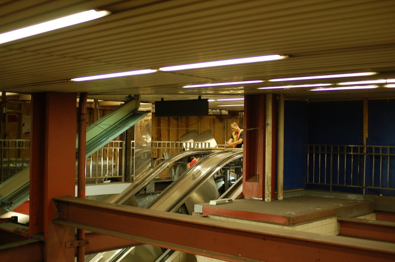 Workers fixing an escalator @ 34 St - Herald Sq (B/D/F/V). Photo taken by Brian Weinberg, 9/6/2006.