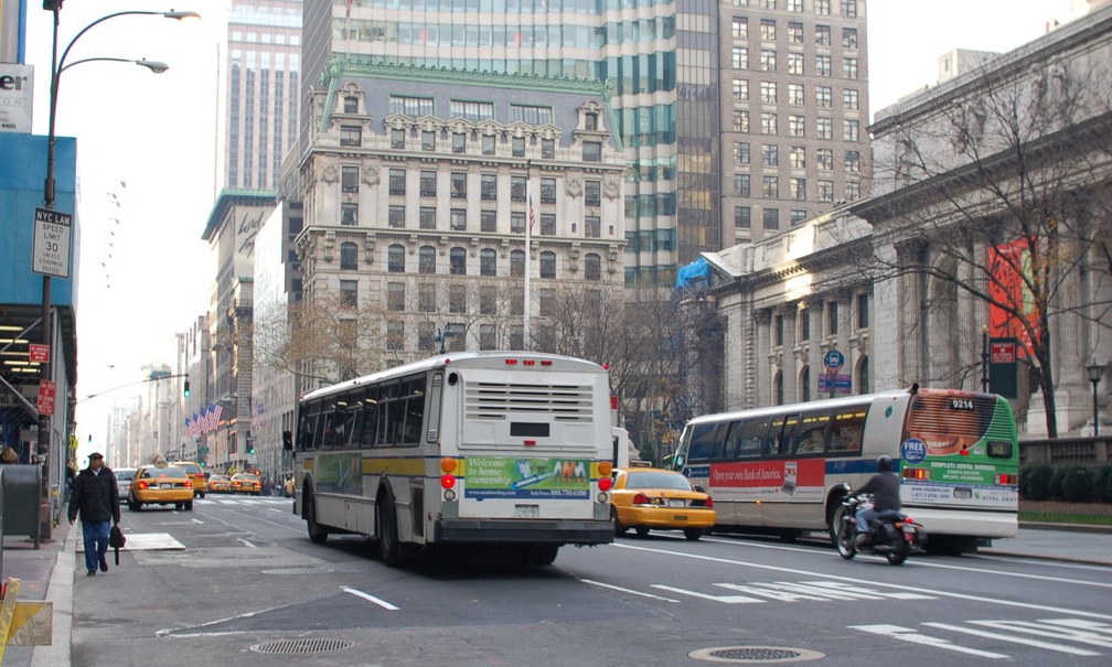 Orion I 8829 and NYCT RTS 9214 @ 5 Av &amp; 42 St. Photo taken by Brian Weinberg, 11/27/2006.