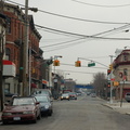 In the distance, the Staten Island North Shore right-of-way crossing over Port Richmond Avenue. Photo looks south. Photo taken b
