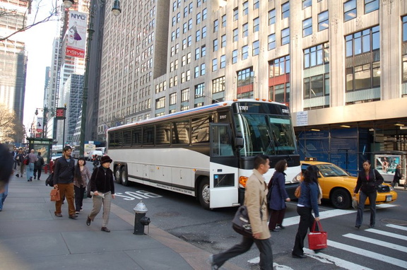 Suburban Trails MCI 102-DLA3 37017 (with an upgraded contemporary style front cap) @ 42 St &amp; 5 Av. Photo taken by Brian Wein