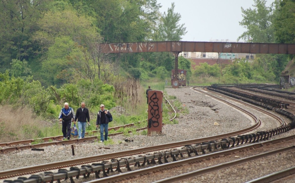 Fishermen walking the tracks @ Riverdale (Hudson Line). Photo taken by Brian Weinberg, 5/20/2007.