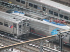 NJT Arrow III 1365 and Amtrak Acela and LIRR M-7 @ Penn Station. Photo taken by Brian Weinberg, 8/17/2007.