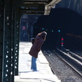 Dyckman St (1). Woman looking into tunnel for oncoming train. Photo taken by Brian Weinberg, 3/2/2008.