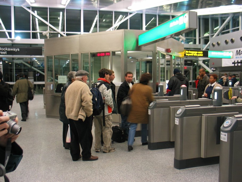 AirTrain customers @ Howard Beach swiping and/or arguing and being let in/out for free.