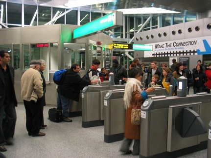 AirTrain customers @ Howard Beach swiping and/or arguing and being let in/out for free.