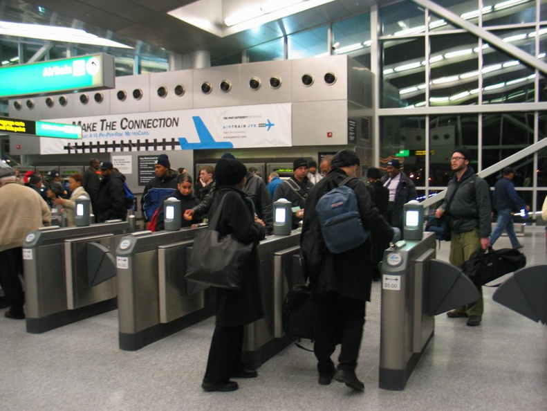 AirTrain customers @ Howard Beach swiping and/or arguing and being let in/out for free.