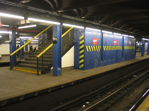 Temporary wooden shed built on to the back of a staircase on the center platform @ 59 St-Columbus Circle. Photo taken by Brian W