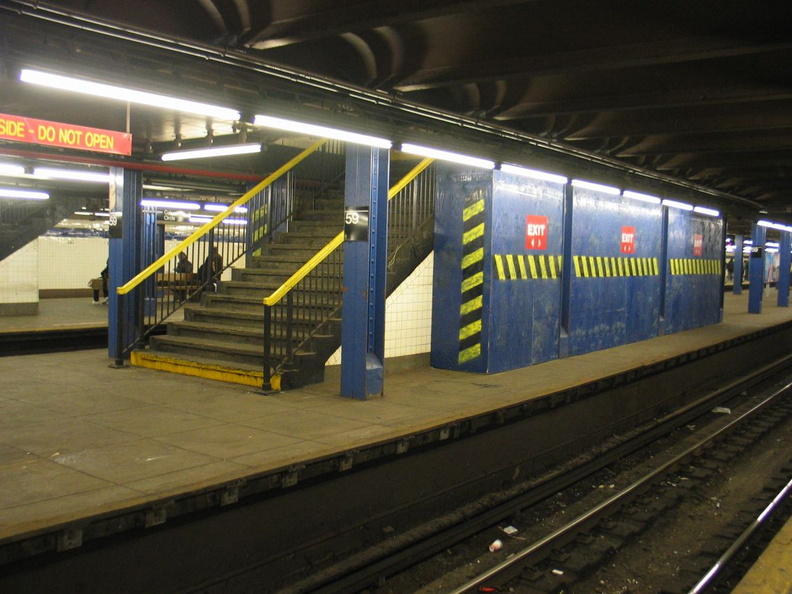 Temporary wooden shed built on to the back of a staircase on the center platform @ 59 St-Columbus Circle. Photo taken by Brian W