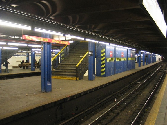 Temporary wooden shed built on to the back of a staircase on the center platform @ 59 St-Columbus Circle. Photo taken by Brian W