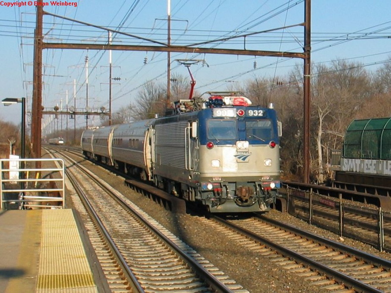 Amtrak AEM7 932 @ Edison, NJ. Note the rear coach seems to be Conference Car 9800. Photo taken by Brian Weinberg, 2/13/2004. IMG_8559a.jpg
