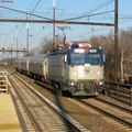 Amtrak AEM7 932 @ Edison, NJ. Note the rear coach seems to be Conference Car 9800. Photo taken by Brian Weinberg, 2/13/2004.