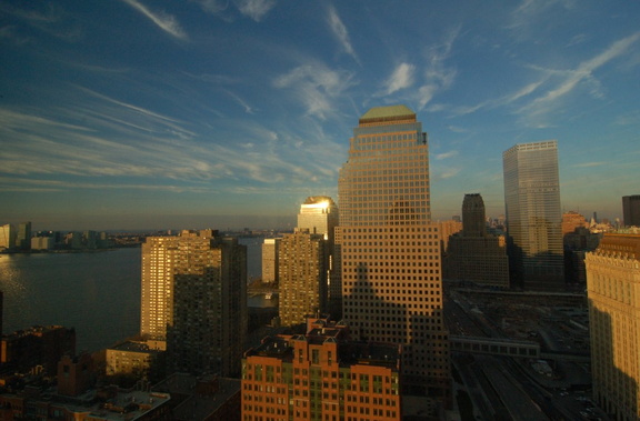 WFC, Route 9A / West Street, and the WTC site, in the sweet light, through a dirty window. Photo taken by Brian Weinberg, 12/3/2