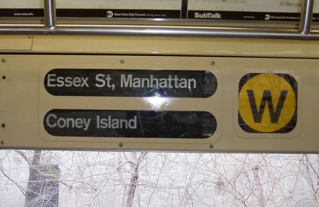 A sign in the lead car of an (M) train at Metropolitan Avenue on 11/27/2002