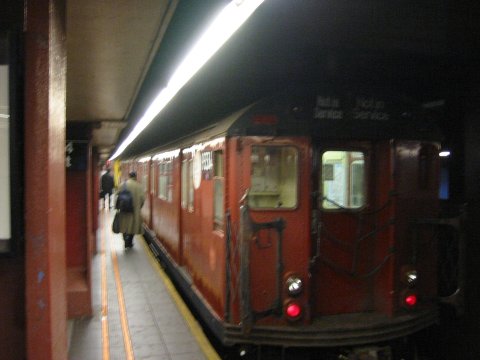 R-33WF 9334 @ 34 St - Herald Square (SB exp track). Part of a work train. Photo taken by Brian Weinberg, 10/22/2004.